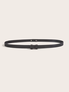 Detail of black Saffiano leather skinny belt with fine stitching and silver metal rivet