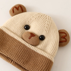 Macro detail of toddler knit bear hat showing premium stitching and 3D ear accents
