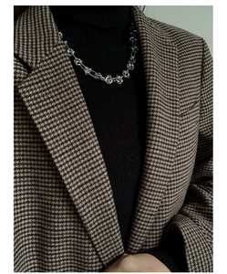 Detailed view of silver interlocking chain links on a minimalist choker necklace for women