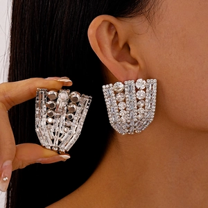 Elegant silver fan-shaped geometric earrings with sparkling zircon crystals in radiant design