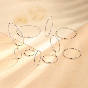Detailed macro view of polished S925 sterling silver hoop earrings in various sizes