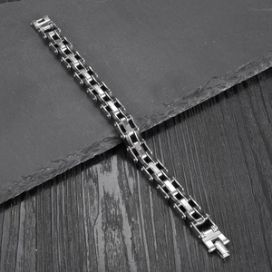 Men's fashion multilayer silicone and stainless steel bracelet on stone background