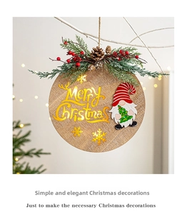 Detail of wooden Merry Christmas hanging sign with gnome, pine needles and berries