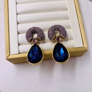 Vintage gold plated silver stud earrings with blue pear gemstone and purple crystal accents