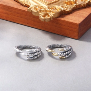 Vintage dragon claw open ring with detailed metal scales in silver and gold duo-tone