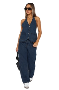 Detail of dark blue denim halter vest with v-neck and buttons on full-body model