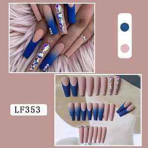 Detailed view of matte blue and nude pink long coffin press-on nails with rhinestones