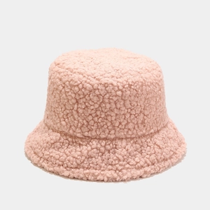 Close-up of soft pink lamb wool bucket hat showing plush texture and fluffy fabric detail