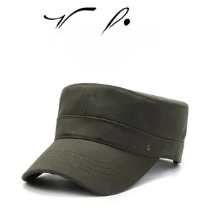 Detail of army green military cap featuring reinforced stitching and bird embroidery