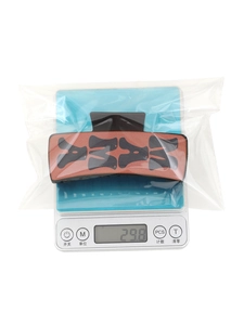 Western cowboy style sunflower claw clip on a digital scale showing 29.8g weight detail