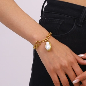 18k gold plated chunky chain bracelet with baroque pearl and OT toggle clasp on wrist