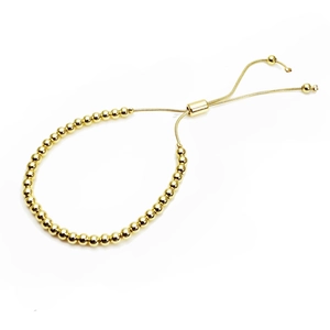 Detail view of gold-plated round beads and adjustable sliding clasp on the bracelet