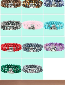Detail of double-layer 8mm natural stone bracelets with Buddha head charms and metal beads