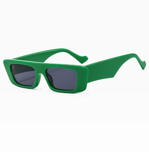 Detail view of emerald green rectangular sunglasses with thick temples and dark lenses