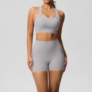Detail of high-stretch sports bra and high-waisted shorts with convenient side pocket