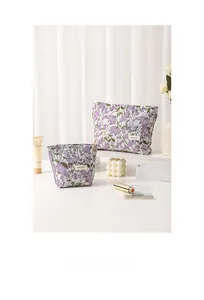 Floral canvas toiletry bags in light blue with purple lavender pattern and top zipper