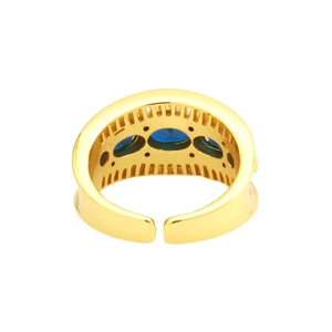 Detail of 18K gold plated X-ring featuring three oval blue gemstones with micro-inlay