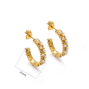 Detail showing 21mm 18k gold plated C-shaped earrings with rows of white pearls