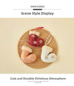 Detailed view of mini Christmas stocking ornaments with white snowflake embroidery