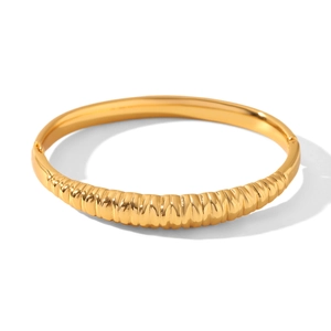 Detail shot of 18k gold plated stainless steel bracelet with textured croissant ridge design