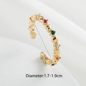 Macro detail of 18K gold-plated open ring with multi-color zircons and diameter scale