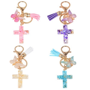 Resin cross keychain set with butterflies and tassels in pink, purple, yellow, and blue