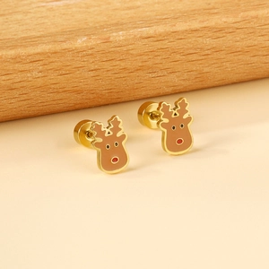 Macro view of gold reindeer earrings with festive red and brown enamel detailing