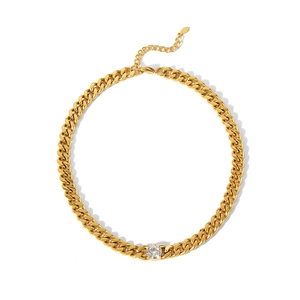 Detail view of 18K gold plated stainless steel Cuban chain with a round zircon pendant