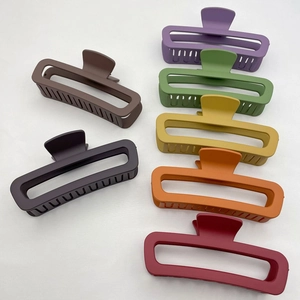 Matte finish rectangular hair claws in seven assorted colors including purple and green