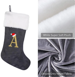 Detail of deluxe grey velvet Christmas stocking with white plush trim and golden letter A