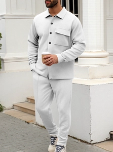 Close-up of light gray waffle knit texture on men's vintage lapel jacket and pants set