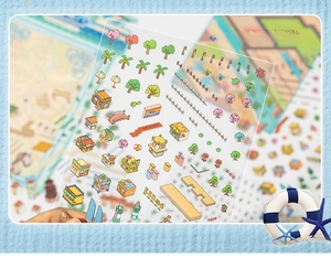 Close-up of 3D miniature city building stickers and cherry blossom trees on PET material