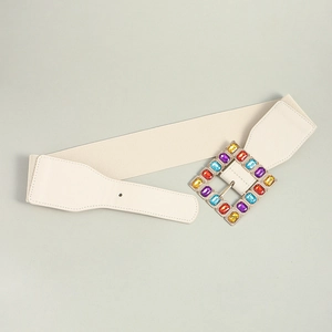 Detail of square buckle with colorful acrylic rhinestones on cream elastic belt