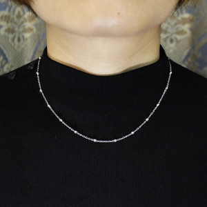 Minimalist silver stainless steel bead necklace shown on person for fashion aesthetic