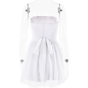 Detail view of white mesh dress back featuring a large bow and invisible zipper