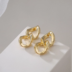 Irregular geometric chain stud earrings in 18K gold plated finish on white display