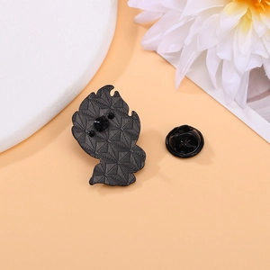 Reverse side of black enamel pin with double metal posts and rubber clutch clasp