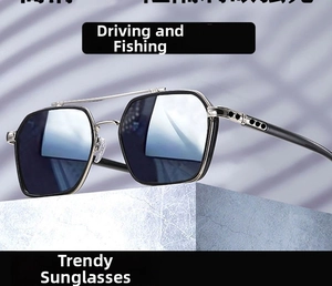 Detail of square frame sunglasses with double bridge and metal accents on a stone surface