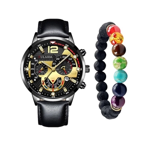 Close-up of men's black leather watch and volcanic stone chakra bead bracelet set