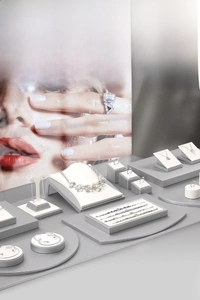 Macro view of multi-level jewelry display stands featuring necklace and ring organizers