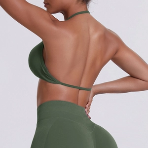 Rear view of seamless deep green racerback sports bra and high-waisted leggings set