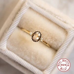 Macro shot of S925 sterling silver vintage ring with oval stone in velvet jewelry box