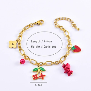 Detail of gold strawberry charm bracelet with dimensions 17 plus 4 cm and 10g weight