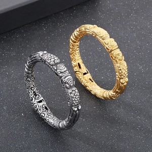 Vintage dragon and cloud pattern cuff bracelets in gold and silver finish with retro texture