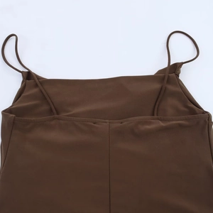Detailed view of the brown camisole dress featuring pleated fabric and slim shoulder straps