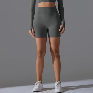 Detail of dark grey high-waist yoga shorts and crop top with thumbhole sleeves