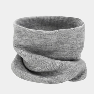 Detailed view of grey knitted neck warmer with elastic horizontal texture for winter warmth