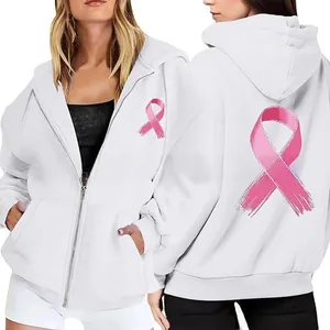 Detail of pink ribbon print on white zip-up hoodie showing high-quality breast cancer awareness logo