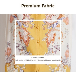 Detail of vintage floral print fabric with fabric-covered buttons on a shirt dress