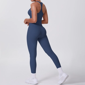 Detail of navy blue racerback sports bra and high-waisted leggings from a back view